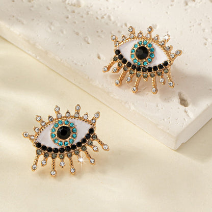 Boucles d'oreilles œil maléfique en strass